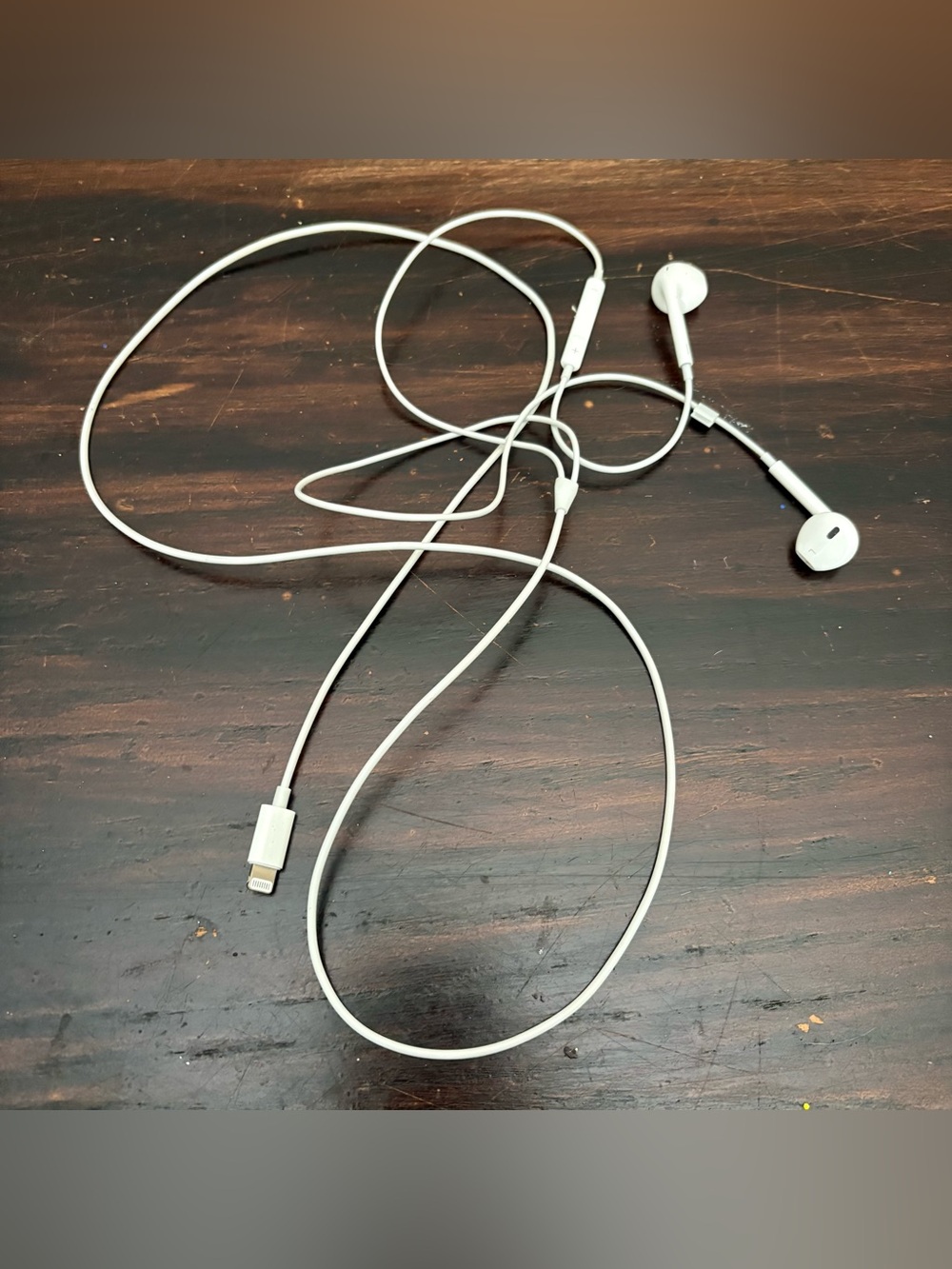 white wired Apple EarPods